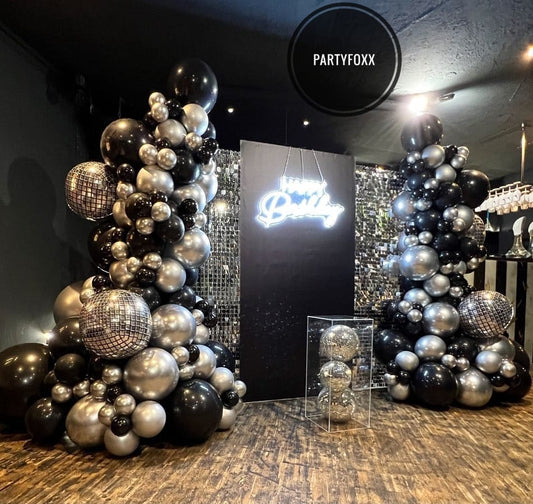 Silver Shimmer Backdrop with Black & Chrome Balloon Pillars for Adults - PARTYFOXX 